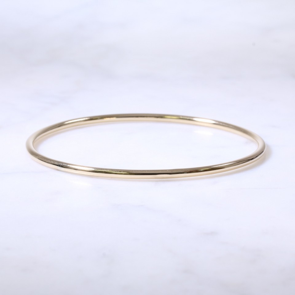 Solid gold sales round bangle